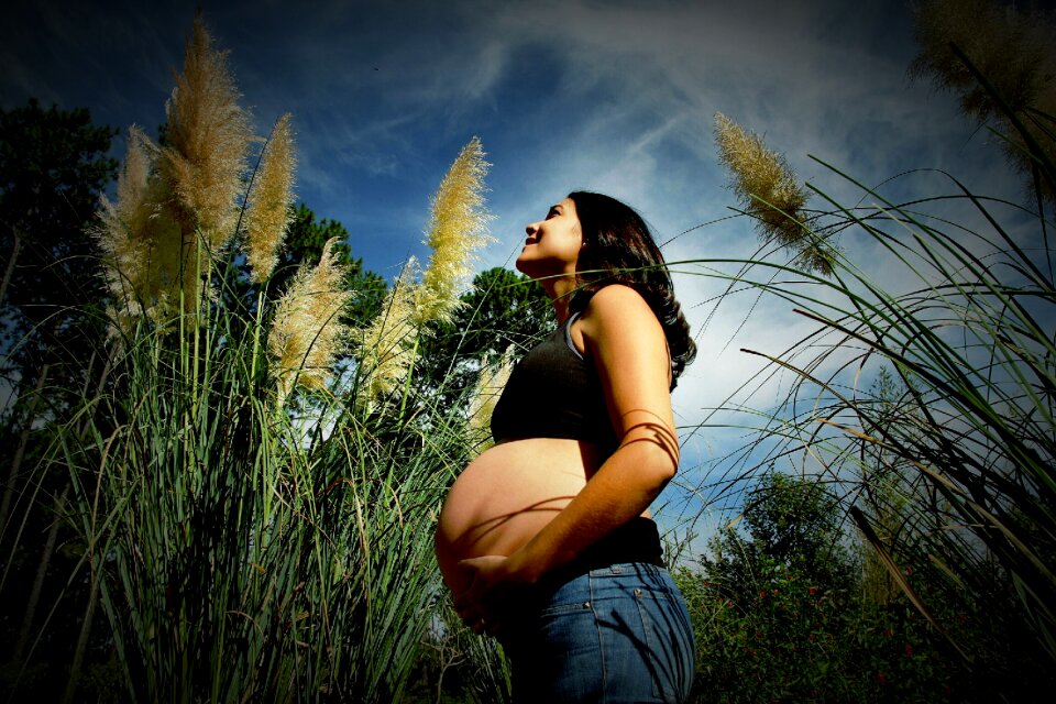 Pregnant woman nature happy