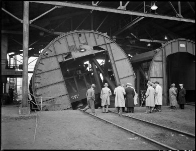 Members of Medical Survey Group inspection party examine coal car unloader in company with local mine officials.... - NARA - 541525