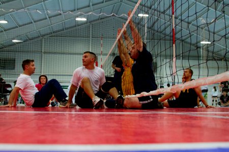 Members of Team Navy-Team Coast Guard practice sitting volleyball for the 2012 Warrior Games. 120428-N-AN499-198