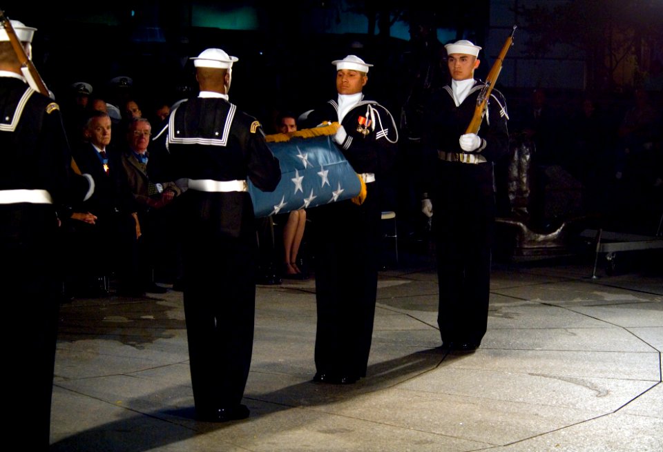 Members of the Navy Ceremonial Guard folding the Medal of Honor Flag to be presented to Daniel and Maureen Murphy (071023-N-5319A-022)