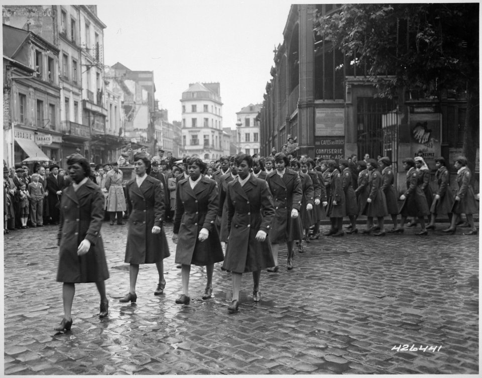 Members of the 6888th Central Postal Directory Battalion take part in a parade ceremony in honor of Joan d'Arc at the marketplace where she was burned at the stake
