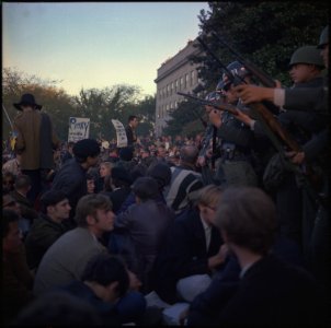 Members of the military police keep back protesters during their sit-in at the Mall Entrance to the Pentagon. - NARA - 530618