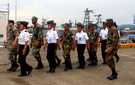 Members of the Panamanian Defense Forces and Sailors deployed aboard wift (HSV 2) muster on the pier during a subject matter expert exchange in Balboa-Rodman, Panama