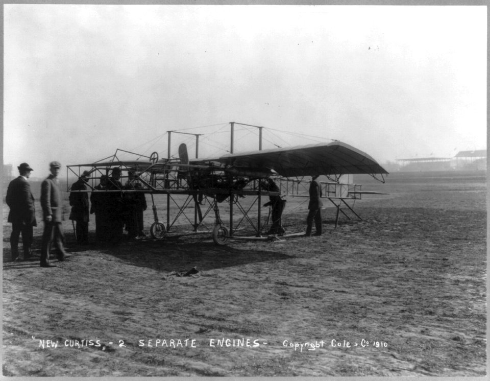 Men inspecting airplane - New Curtiss - 2 separate engines LCCN2006684407