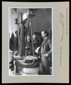Men weighing old silver for coins at the United States mint in Philadelphia LCCN2018645930