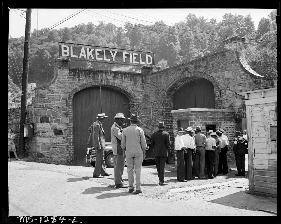 Men, mostly miners, going to baseball game. The two teams were mining camp teams. Welch, West Virginia. - NARA - 540766