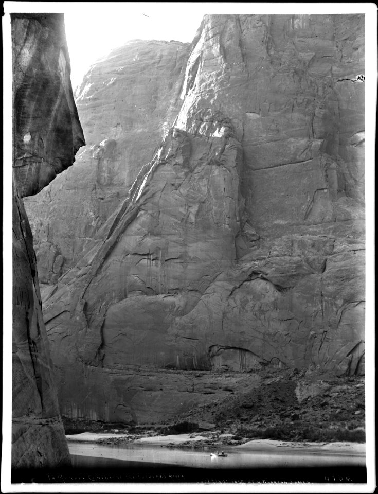 Men in a small boat in Marble Canyon, Colorado River, ca.1898 (CHS-4709)