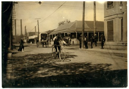 Messenger boy in the heart of the Reservation delivering messages. Prostitutes run back and forth. Business beginning at mid-day. I saw messenger boys and delivery boys for drug stores from LOC nclc.03903
