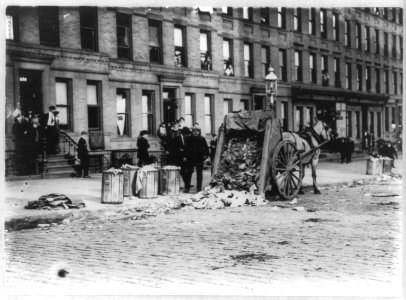 N.Y.C. Garbage collector's strike, 1911- horse-drawn garbage cart dumped on street; 72nd St. & 1st Ave. LCCN2007678132