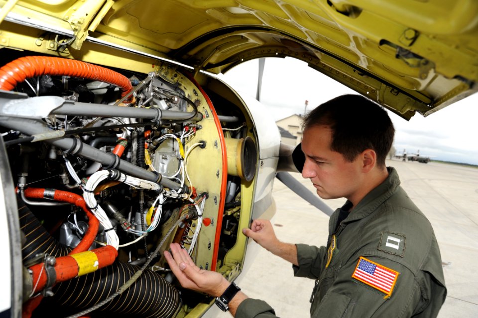 NAF Misawa crew members conduct pre-flight inspection on UC-12F Huron 120720-N-ZI955-014