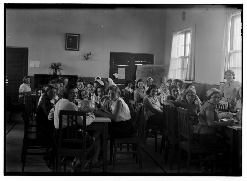 Nahalal. Girls' agricultural training school. Girl students at a meal. Int(erior) of the dining room LOC matpc.02687