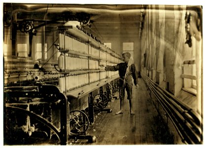 Name- Mule-spinning room in Chace Cotton Mill, Raoul Julien, 'a back-roping boy.' Has been here 2 yrs. see label No.730. May 7, 1909. LOC cph.3a17764