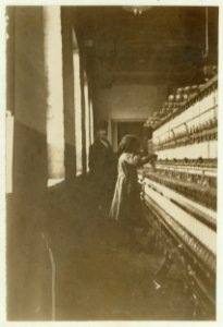 Name- Little girl (48 inches high) work in Amoskeag Mfg. Co., Manchester, N.H. She seemed to be 11 or 12 yrs. old. Photo taken at noon, May 25, 1909. LOC nclc.01782