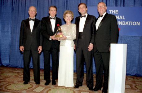 Nancy Reagan accepting an award with Donald Trump and George Allen