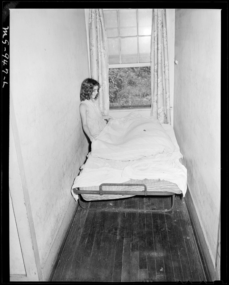 Narrow alcove used as a bedroom in home of A. J. Donaldson, miner, living in company housing project. Tennessee Coal... - NARA - 540620