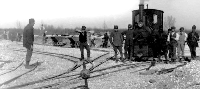 Narrow gauge steam train with V skip wagons