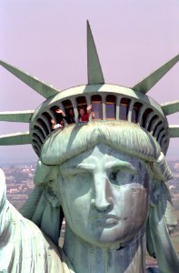 Nancy Reagan waves while visiting the Statue of Liberty in New York City