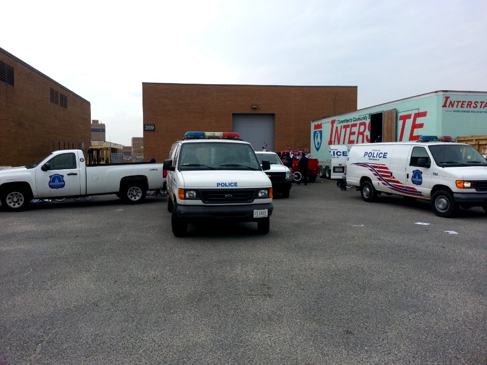 Metropolitan Police Department vehicles stage at Joint Base Anacostia-Bolling (JBAB) to transport bicycles 131217-N-CG900-006