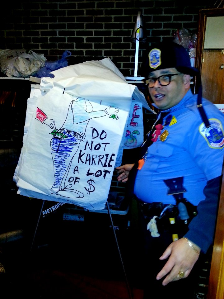 Metropolitan Police Department (MPD) safety outreach officer teaches holiday safety tips to youth 131218-N-CG900-014