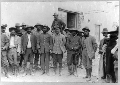 Mexican War, 1914- Rebel leader standing with group LCCN2003655572