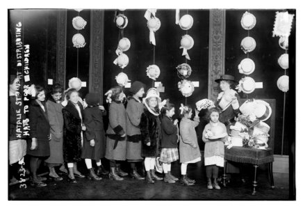 Natalie Stewart Distributing hats to poor children LCCN2014701469