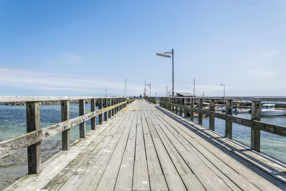 Pier bridge on the water photo