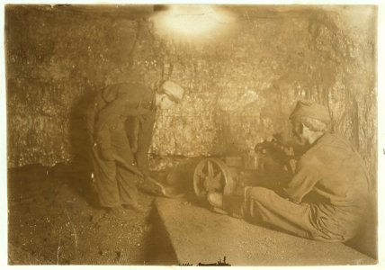 National Child Labor Committee, No. 69. Man with punching machine to drill into coal. Boy shovels out 10 hrs. daily, Laura Mine, Red Star, W. Va. LOC cph.3c19791