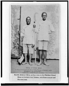 Native African boys, as they come to the Christian School House at Arthington, Liberia, with ploughshare and pruninghook LCCN94509918