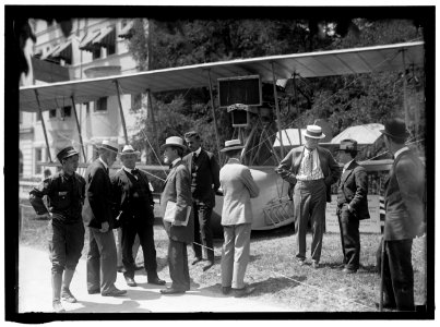 NATIONAL AERO COAST PATROL COMMN. CURTISS HYDROAEROPLANE OR FLYING BOAT EXHIBITED NEAR HOUSE OFFICE BUILDING. REP. CHARLES LIEB; REP. J. KAHN; SEN. KERN; CAPT. TAYLOR; ADM. PEARY; E.H. SMITH LOC hec.02465 photo