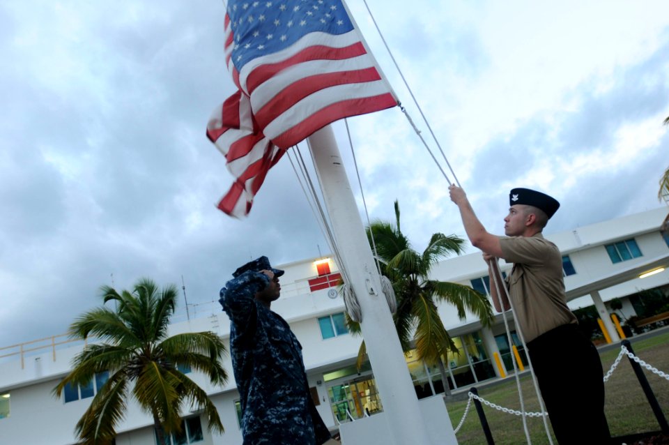 National ensign at sunset in Guantanamo Bay DVIDS378403