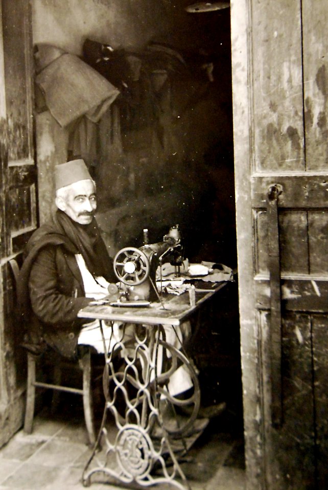 Native craftsman using sewing machine in Tripoli, Libya 1943 (27015174410)