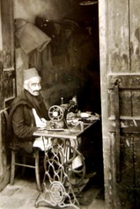 Native craftsman using sewing machine in Tripoli, Libya 1943 (27015174410)