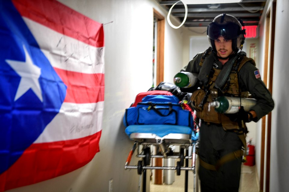 Naval Air Crewman retrieves empty oxygen tanks from Centro Medico in San Juan (36946697013)