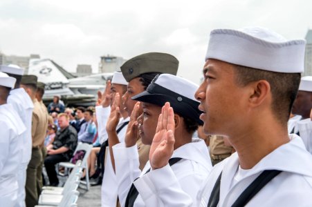Naturalization ceremony held aboard USS Midway 150701-N-QC631-035