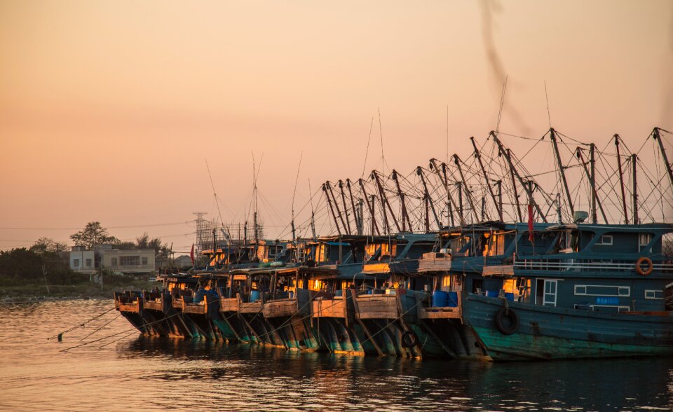 Fishing sunset fishing boats photo