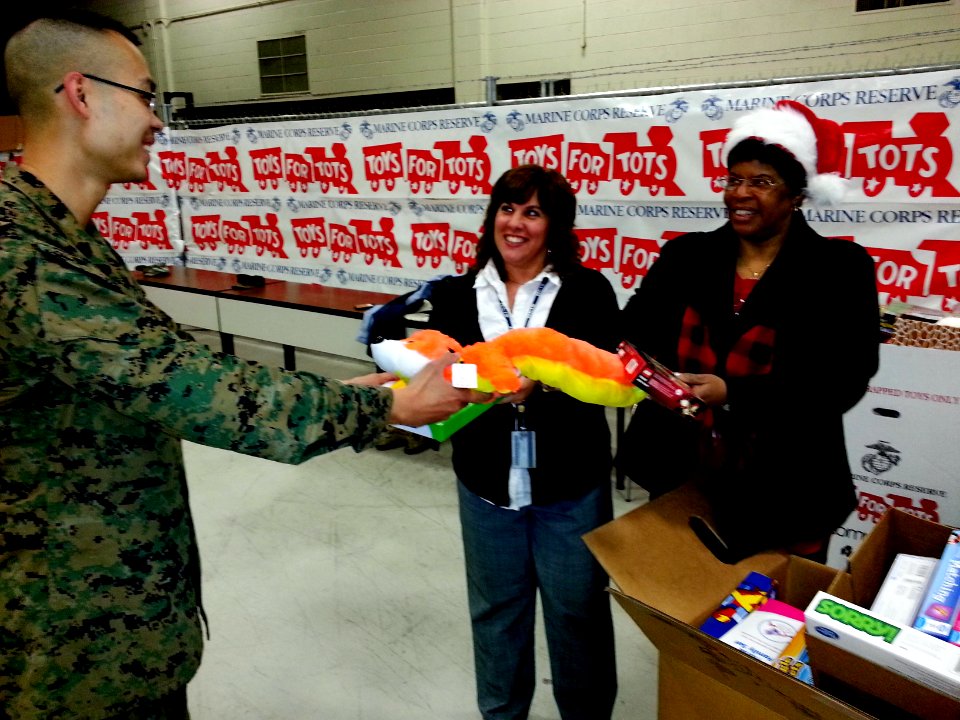 Naval Criminal Investigative Service (NCIS) Washington Field Office employees help make the holidays better for youth 131220-N-CG900-002