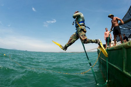 Navy diver enters water during POW-MIA recovery mission 150527-N-IP743-011