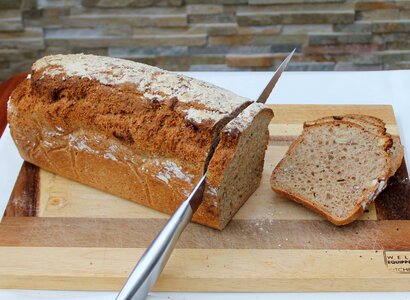 Bread cutting fresh bread homemade