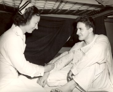 Navy nurse signing cast -- WWII