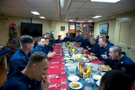 Navy officer eat Christmas dinner aboard USS Stout 131224-N-UD469-831