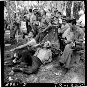 Navy personnel on liberty at Mogmog Island. Enlisted men lounge about a tiny island with plenty of beer. - NARA - 520730