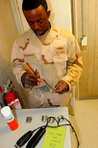 Navy barber cuts detainee hair DVIDS357420