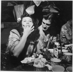 Navy pilots relax and enjoy feminine companionship, sports and entertainment at Chris Holmes Rest Home, maintained... - NARA - 520961