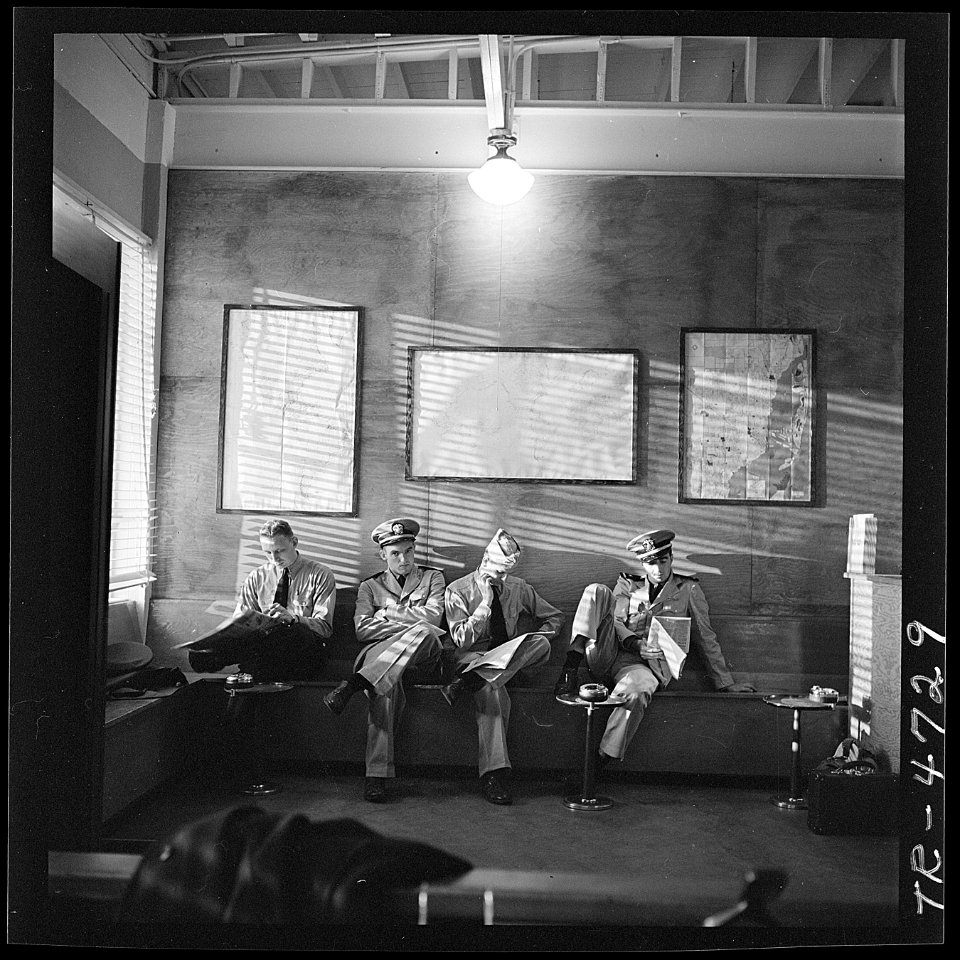 Navy pilots waiting in the office of NATS at Miami, Florida for transportation to Trinidad, B.W.I. - NARA - 520699