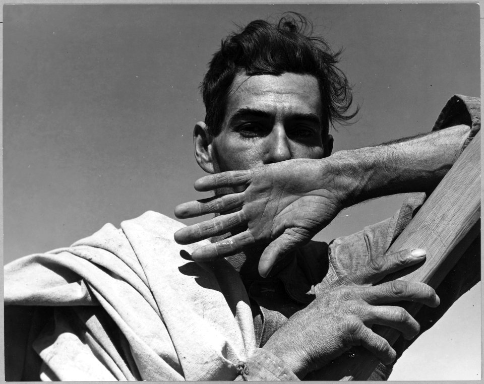 Near Coolidge, Arizona. Migratory cotton picker with his cotton sack slung over his shoulder rests a . . . - NARA - 522042