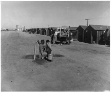 Near Eloy, Pinal County, Arizona. Grower's camp for Mexican cotton pickers. Peddlers visit the camps . . . - NARA - 522495
