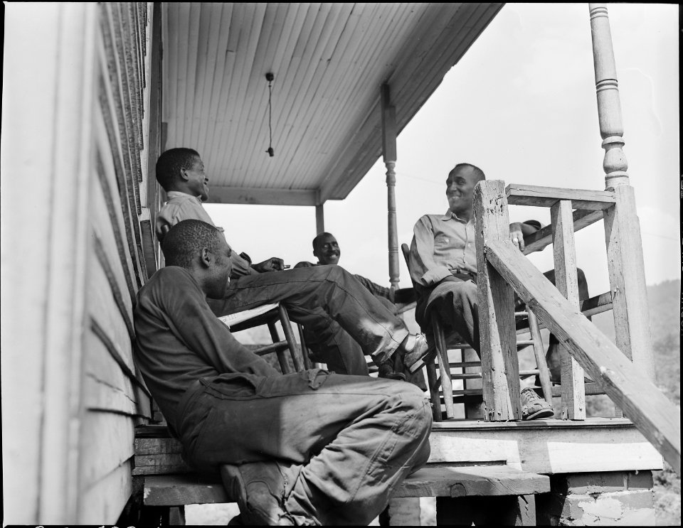 Negro boy, son of miner, drinking from faucet. This is the only constant source of water in the camp. Mullens... - NARA - 540940