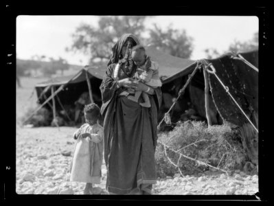 Negroid mother and children. Before their tent home among the foot hills near Beit Jibrin LOC matpc.15653