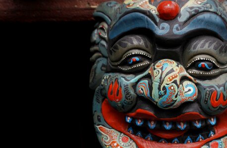 Mask wood carving hanging temple photo