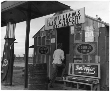 Near Buckeye, Maricopa County, Arizona. Store at grower's camp for migratory cotton pickers. Surplus . . . - NARA - 522539 photo